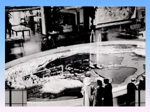 Pacific Basin Fountain in main lobby of Pacific House, 1939--note spouting whales in center of fountain and Covarrubias miural at the top right of photo